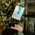 Coffee bag tossed in the air. 